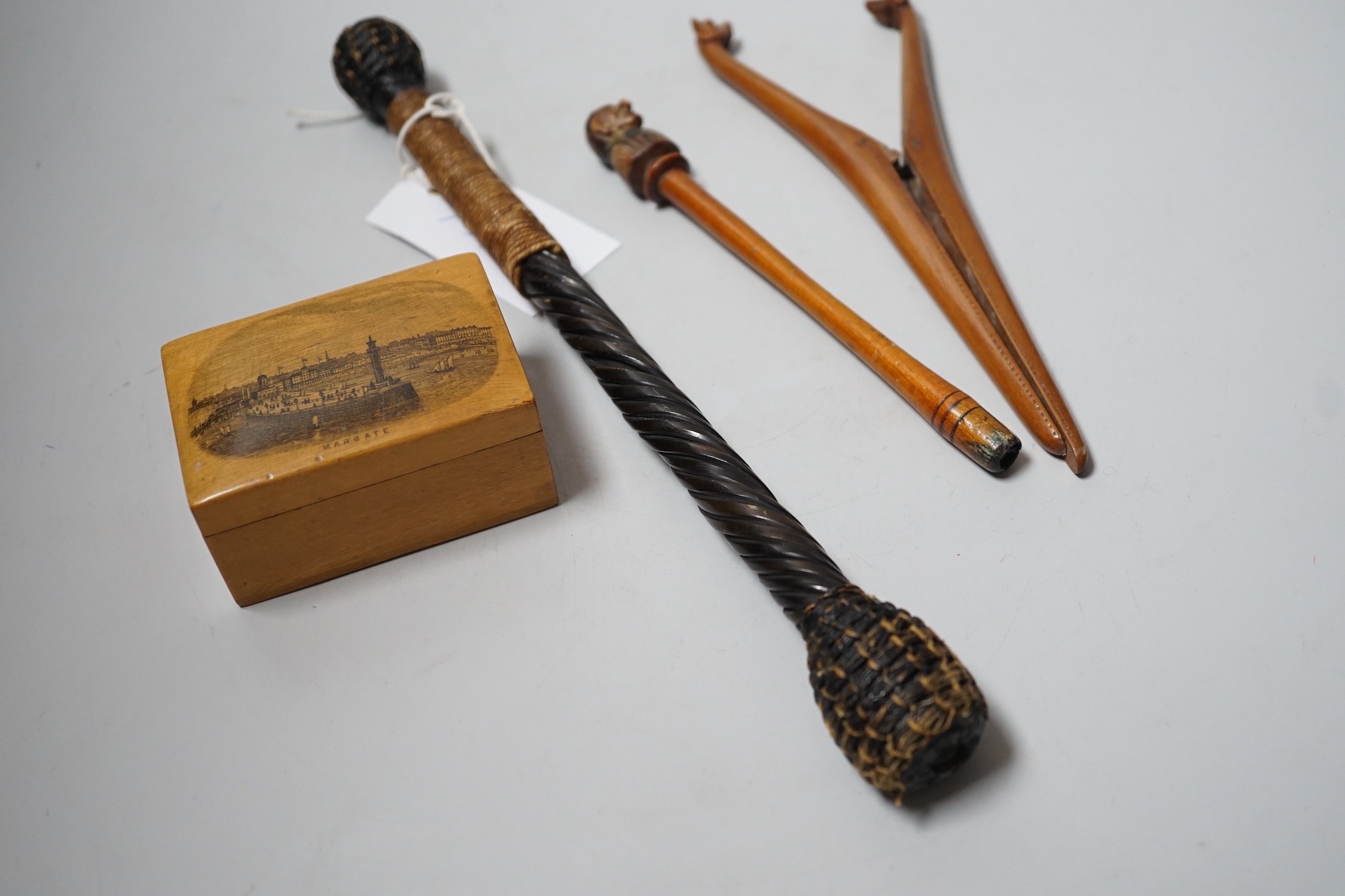 A pair of novelty treen glove-stretchers, 19cm, a similar pipe, a mauchline box and a 19th century beater